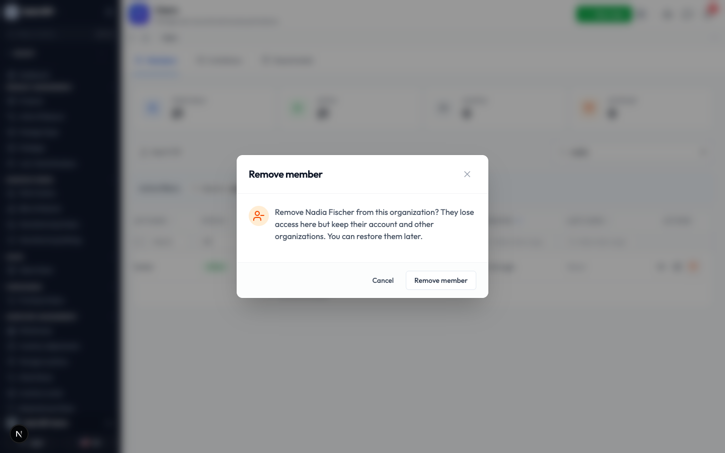 The Remove member confirmation explaining the person loses access here but keeps their account